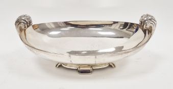 George V silver Art Deco silver bowl, crescent-shaped, twin handled, on four shaped feet, hallmarked