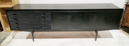 Mid-century black painted teak sideboard comprising four drawers with reeded fronts with knob