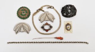 Irish bog oak brooch carved in the form of leaves, yellow metal stickpin, the coral handle wrapped