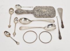 Silver-backed dressing table mirror profusely decorated with flowers and scrolls, a pair of silver