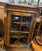 Brights of Nettlebed oak hanging corner cabinet in the 18th century manner, the glazed door