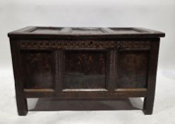 18th century oak coffer, the three-panel hinged lid opening to a later section space, carved three-