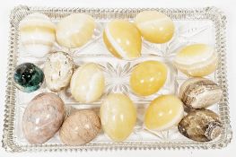Collection of 14 polished agate eggs, largest 7.5cm high together with a resin egg-shaped