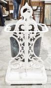 Victorian cast iron double-sided stickstand, later white painted, with pierced foliate scroll