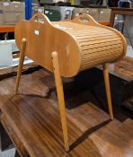 Mid century beech wood sewing box with tambour roll top opening to an interior with two lift out