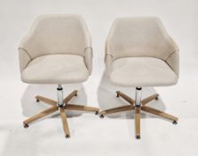 Pair of Koda swivel desk chairs designed by Andrew Martin, upholstered in a natural linen fabric