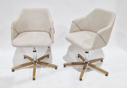 Pair of Koda swivel desk chairs designed by Andrew Martin, upholstered in a natural linen fabric