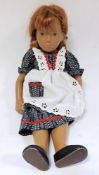 Vintage Sasha doll with red hair in ponytail, brown eyes and navy blue dress printed with flowers