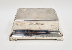 Silver table cigarette box, Birmingham 1932, of rectangular form with engine-turned hinged cover and