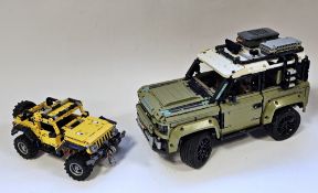 Lego Technic Land Rover Defender no.42110  together with a Jeep Wrangler no. 42122 both models built