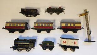 Hornby 0-4-0 clockwork Locomotive 50153 and four wheel BR tender together with Hornby rolling stock,