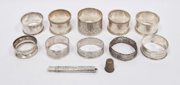 Collection of nine silver napkin rings mainly early 20th century, including a pair with gadrooned