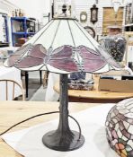 Tiffany style table lamp, the leaded and glass effect shade decorated with butterflies, on a bronzed