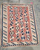Large salmon ground kilim with four rows of eight hexagonal medallions, multiple rows of geometric