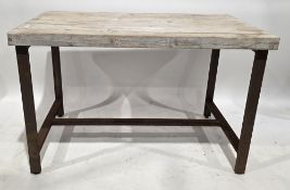 Industrial-style bar table with pine scaffold plank top, on a rusted metal base with straight