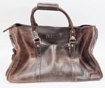 Brown leather holdall travel bag, with two carrying handles and zipped compartments 53cm long