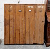 Early to mid-20th century pine factory/school locker cabinet comprising four compartments with panel