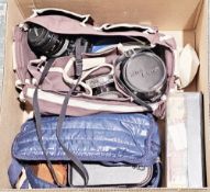 Collection of cameras, binoculars, accessories and equipment including a Canon A-1 camera with Nikon