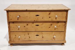 Large 19th century continental pine chest, the rectangular top over three long drawers with