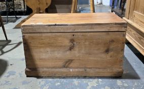 19th century pine blanket box, the hinged lid opening to a lidded candle box, with iron handles,