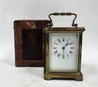 20th century brass cased carriage clock, the enamel dial with Roman numeral hour markers,
