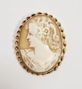 Yellow metal cameo portrait brooch depicting the head and shoulders of a lady, of oval form, the