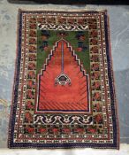 Eastern orange ground prayer rug with hanging basket design, floral shape field flanked by single