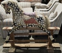 Early to mid 20th century dapple painted rocking horse on wooden base