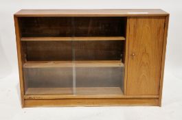 Mid-century Herbert Gibb autographed teak side cabinet comprising two sliding glass doors opening to