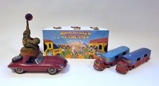 Tinplate clockwork elephant holding globe together with a boxed Oxford Diecast Broncho Bill's
