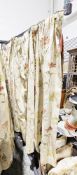 Four pairs of curtains decorated with flowers, ferns and leaves, on a pale gold-coloured fabric,