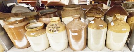 Collection of stoneware items including eight flagons, two marked for Ross and another for Hereford,
