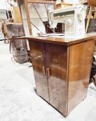 Singer electric sewing machine model no.507, folding into a walnut cabinet with two panel doors,