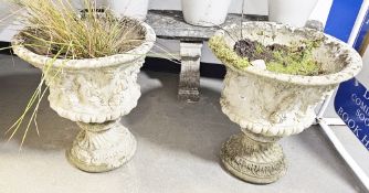 -- Lot Withdrawn -- Pair of composite stone garden urns moulded with a Bacchus design of fruits