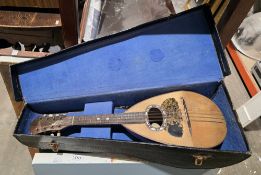 Cased Gronday Michele Maratar mandolin with tortoiseshell and mother-of-pearl inlay