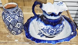 Victorian-style blue and white ceramic wash bowl and jug decorated with flowers together with a