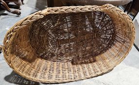 Large wicker dog basket, 28cm high x 108cm wide (please note VAT will be payable on the hammer)