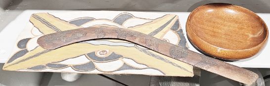 Australian Aboriginal hardwood boomerang, 57cm long, a painted bark panel and a wooden bowl