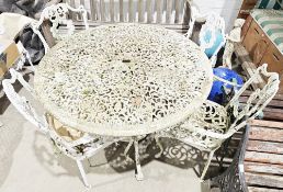 Garden metal table and chairs set with a white finish, comprising a circular table with pierced top,