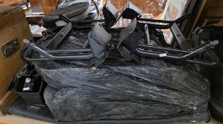 Two Land Rover Defender black fabric car seats, a Land Rover boot rubber mat and two bike racks (