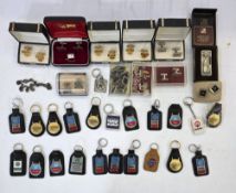 Assorted car branded key rings and cufflinks, including Chrysler, Motaquip, Mopar, GM and others,