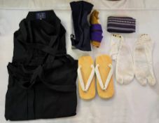 Unworn Japanese archery sports costume to include the original shoes, the slipper socks, the belt