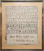 Sampler, black needlework 'Anne Dukes finished this, September 19th 1811', alphabet and numbers,