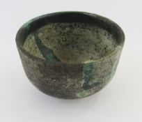 Japanese-style raku bowl having straight sides, on circular foot with green manganese, brown and