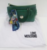'Love Moschino' green leather handbag, double zipped compartments, a side pocket with silver
