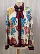 Gucci silk shirt, labelled Gucci , floral design on a cream silk ground, signature red and blue