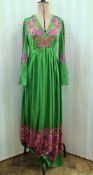 1970's polyester maxi dress, green with paisley style pattern to the 'V' necked bodice and angel