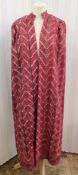 A 1920's silk embroidered cloak, possibly Indian Punjabi region, green satin lining, possibly