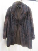 A vintage three quarter length mink coat labelled Charles Moss Furs