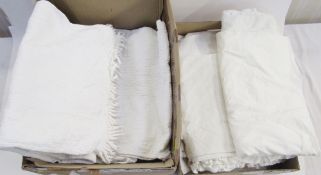 A pair of white quilted curtains, 220cm drop, with a white rope fringe to the hem, 92cm wide,